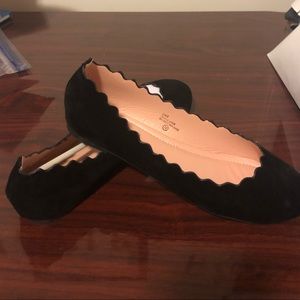Black scalloped edge faux sued flats
